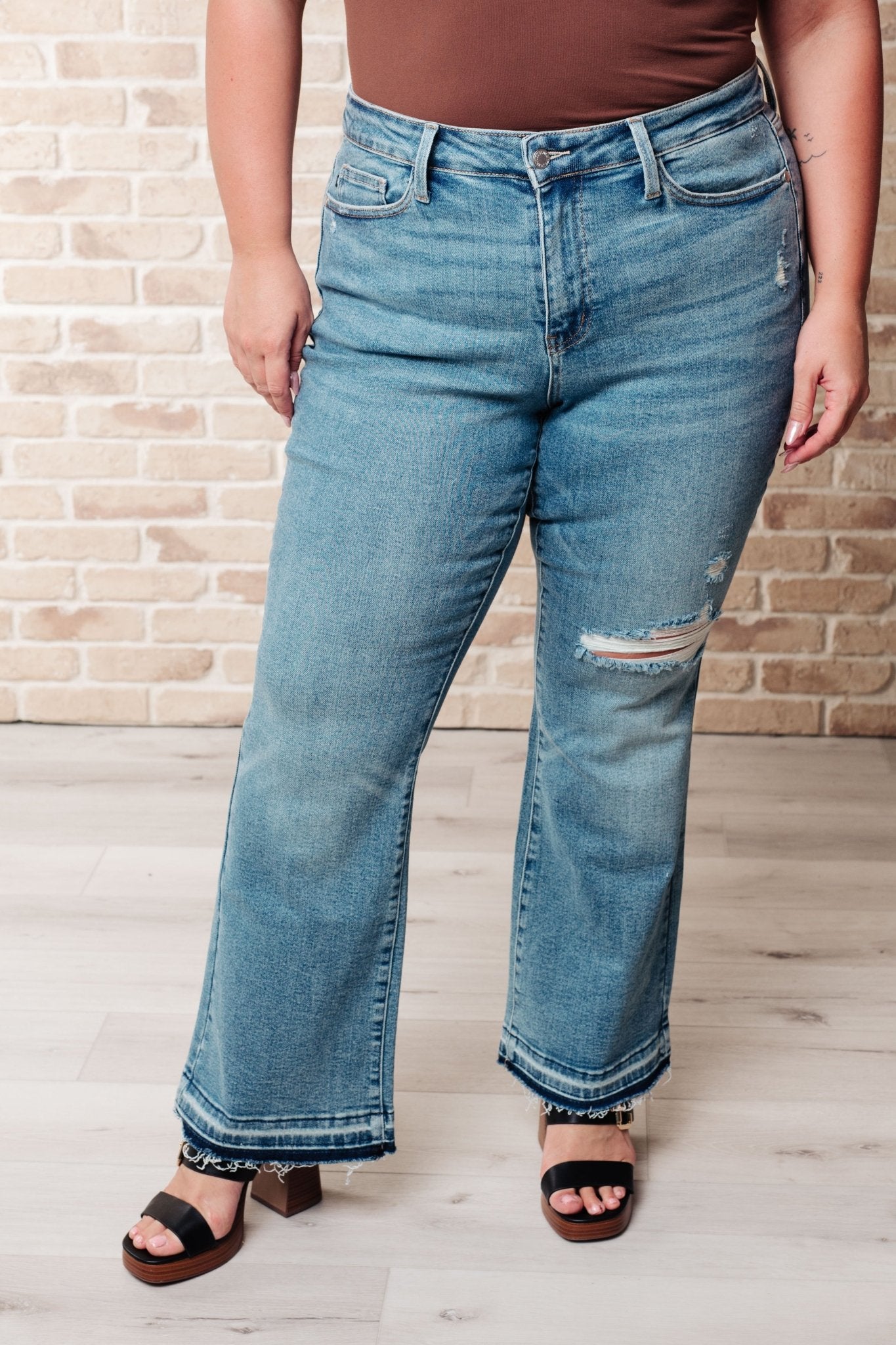 Isla Mid Rise Distressed Released Hem Bootcut Jeans - Loving God