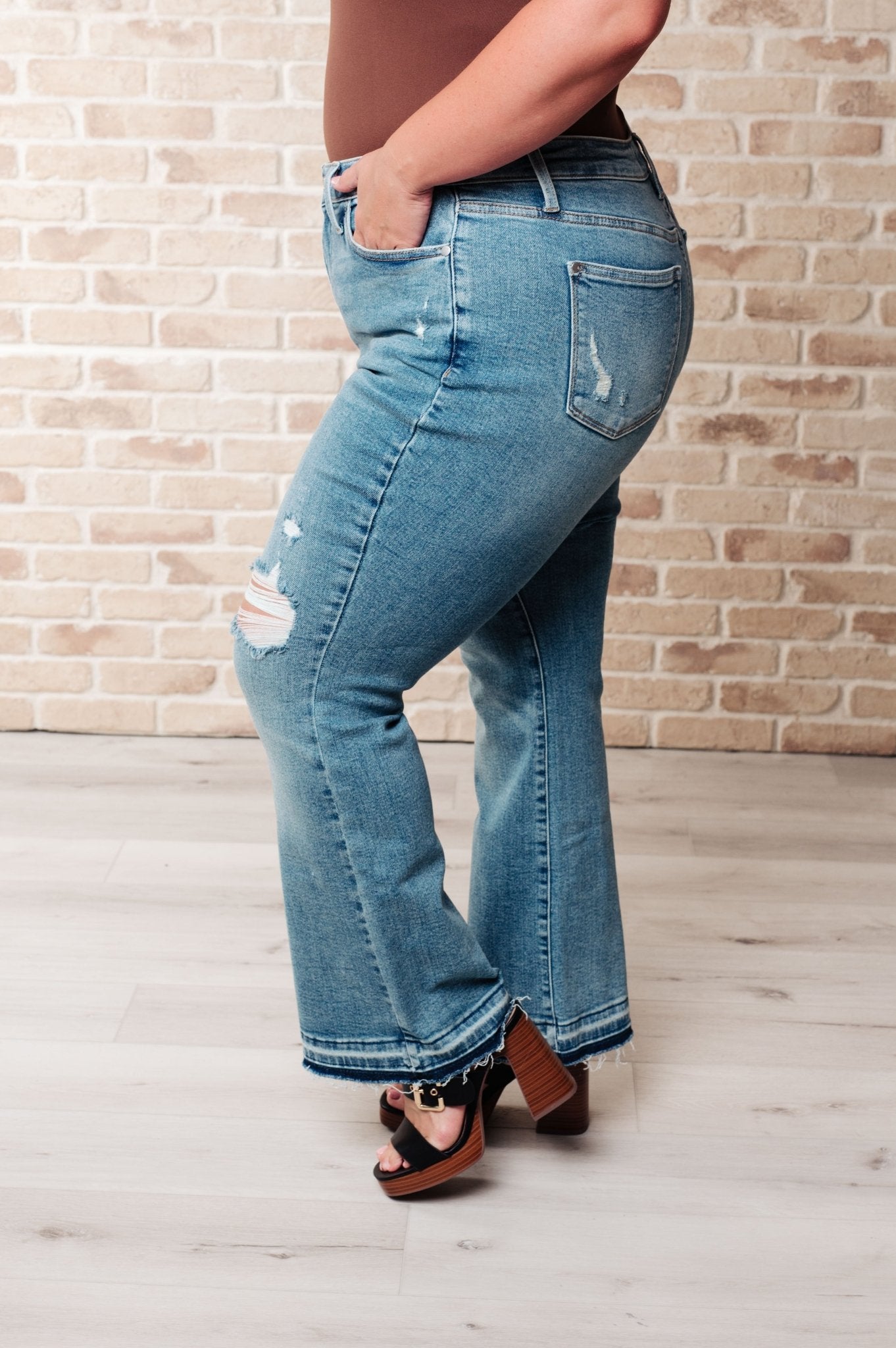 Isla Mid Rise Distressed Released Hem Bootcut Jeans - Loving God