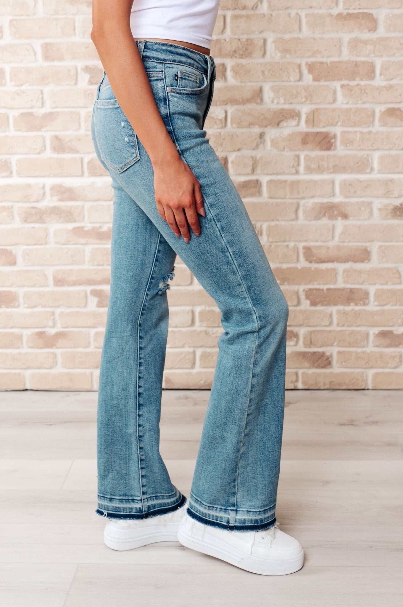 Isla Mid Rise Distressed Released Hem Bootcut Jeans - Loving God